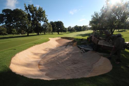 The-Wanderers-Golf-Club-Sand-going-into-Bunker-Barrier-lined-bunker